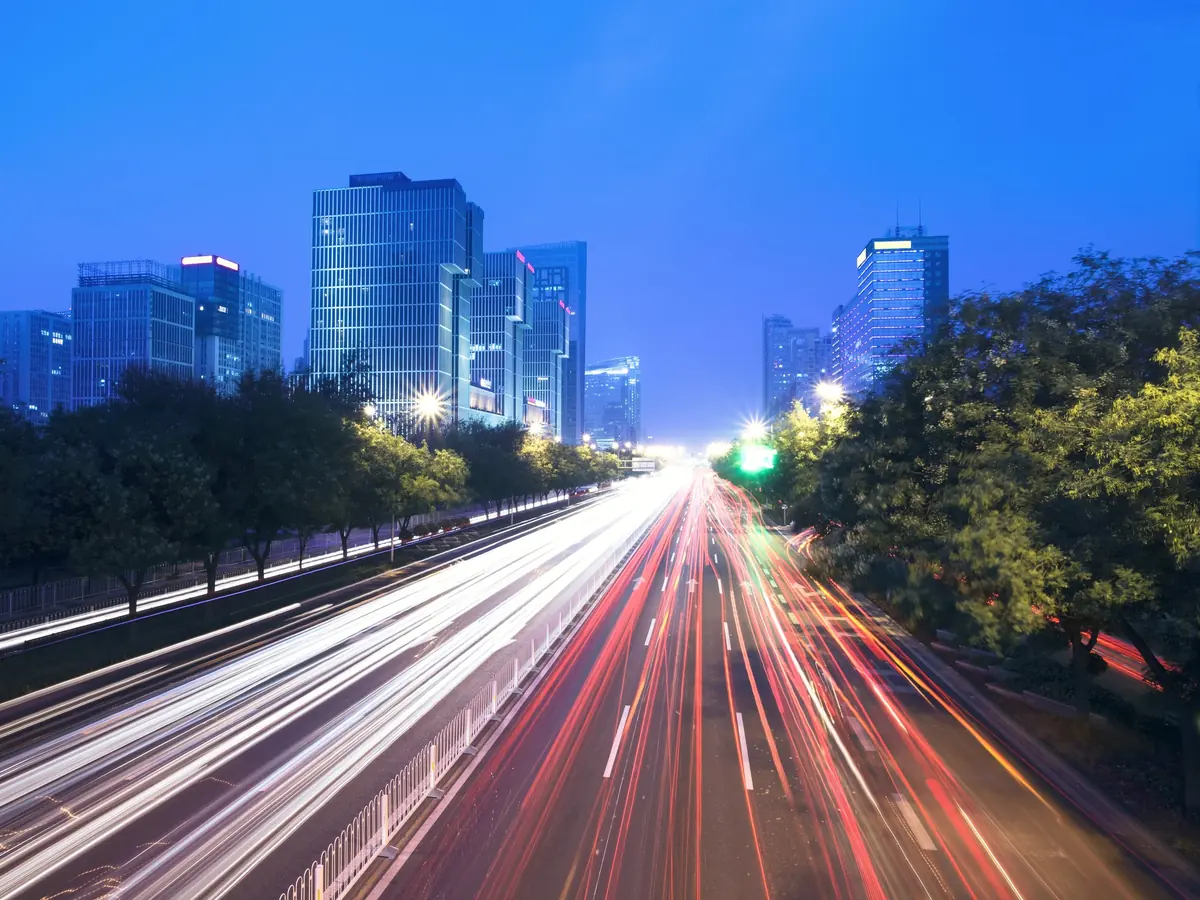 Light trails on a city road at dusk