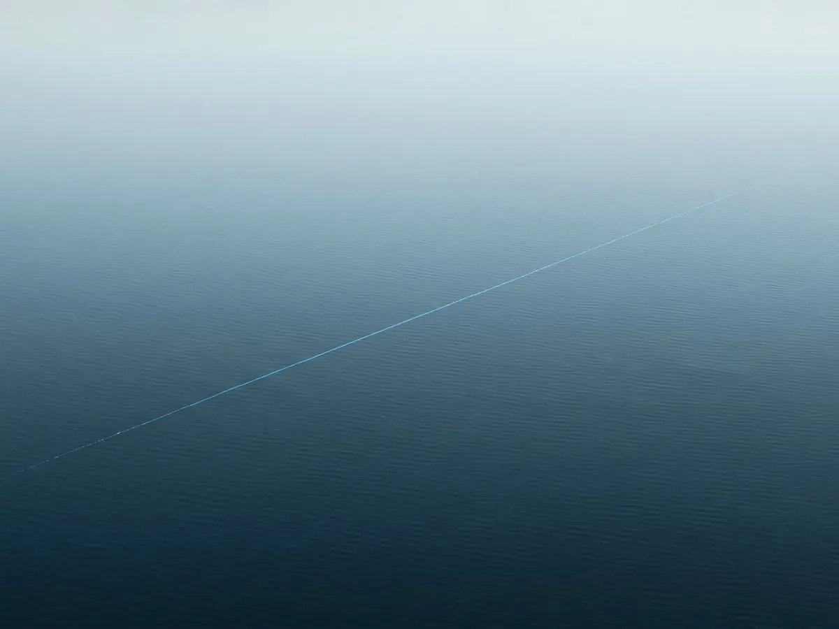 Cyan light across still water at dawn