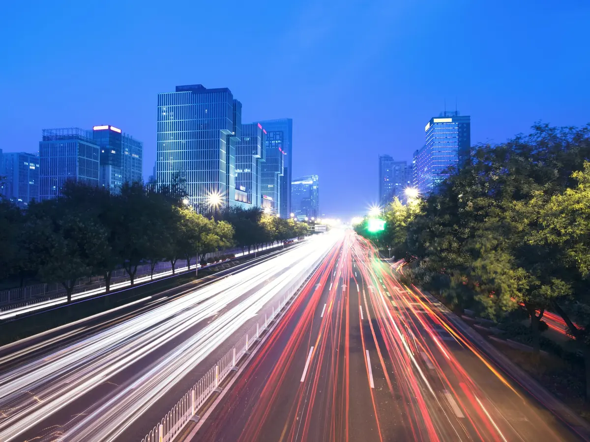 Light trails on a city road at dusk